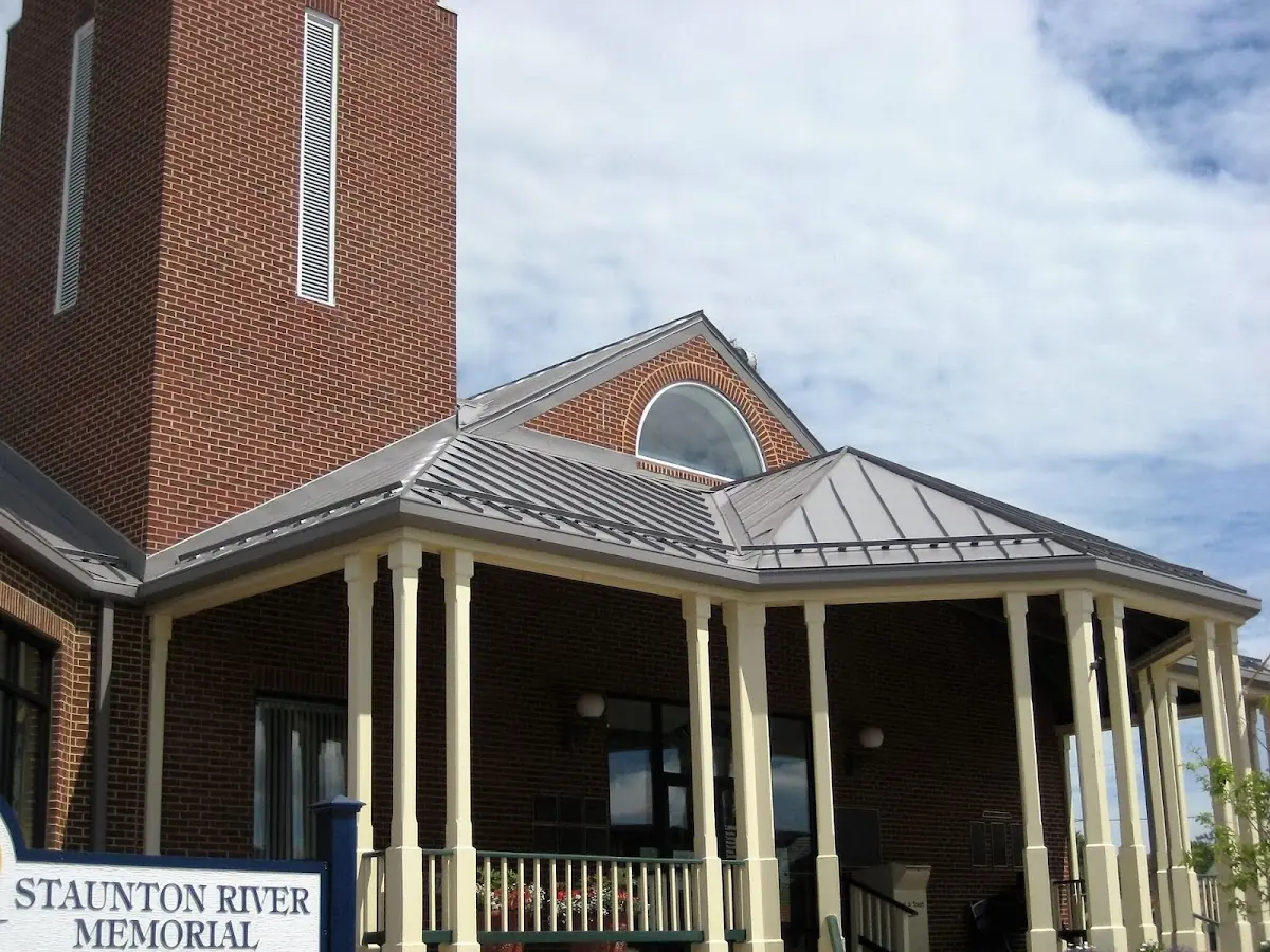 Skilled roofing craftsmen working on a residential roof in Wake Forest